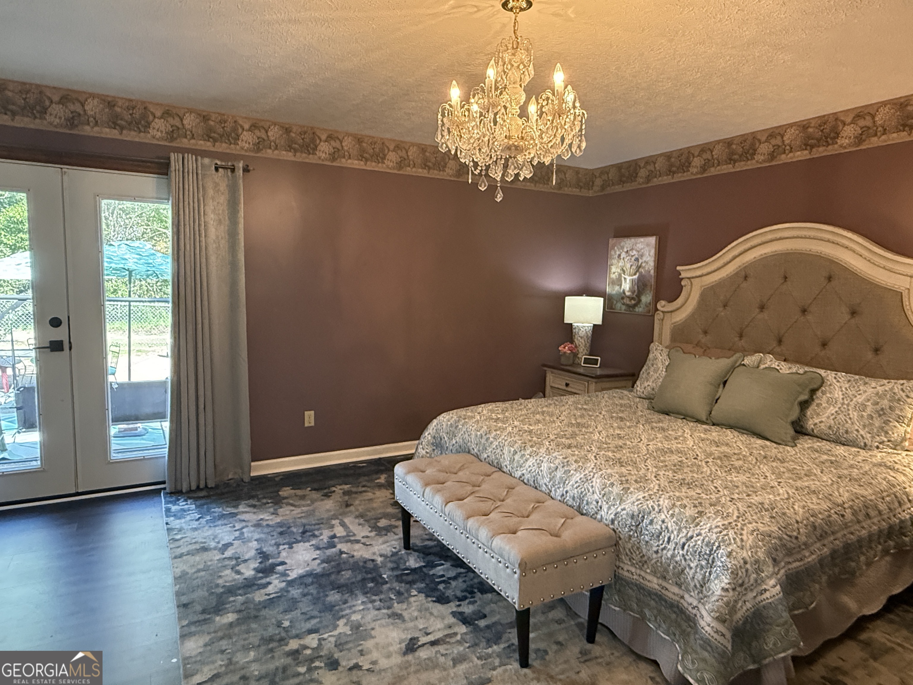 104 Monte Place Cordele, GA 31015 - Photo 20 of 52 a bedroom with a bed chandelier and a window