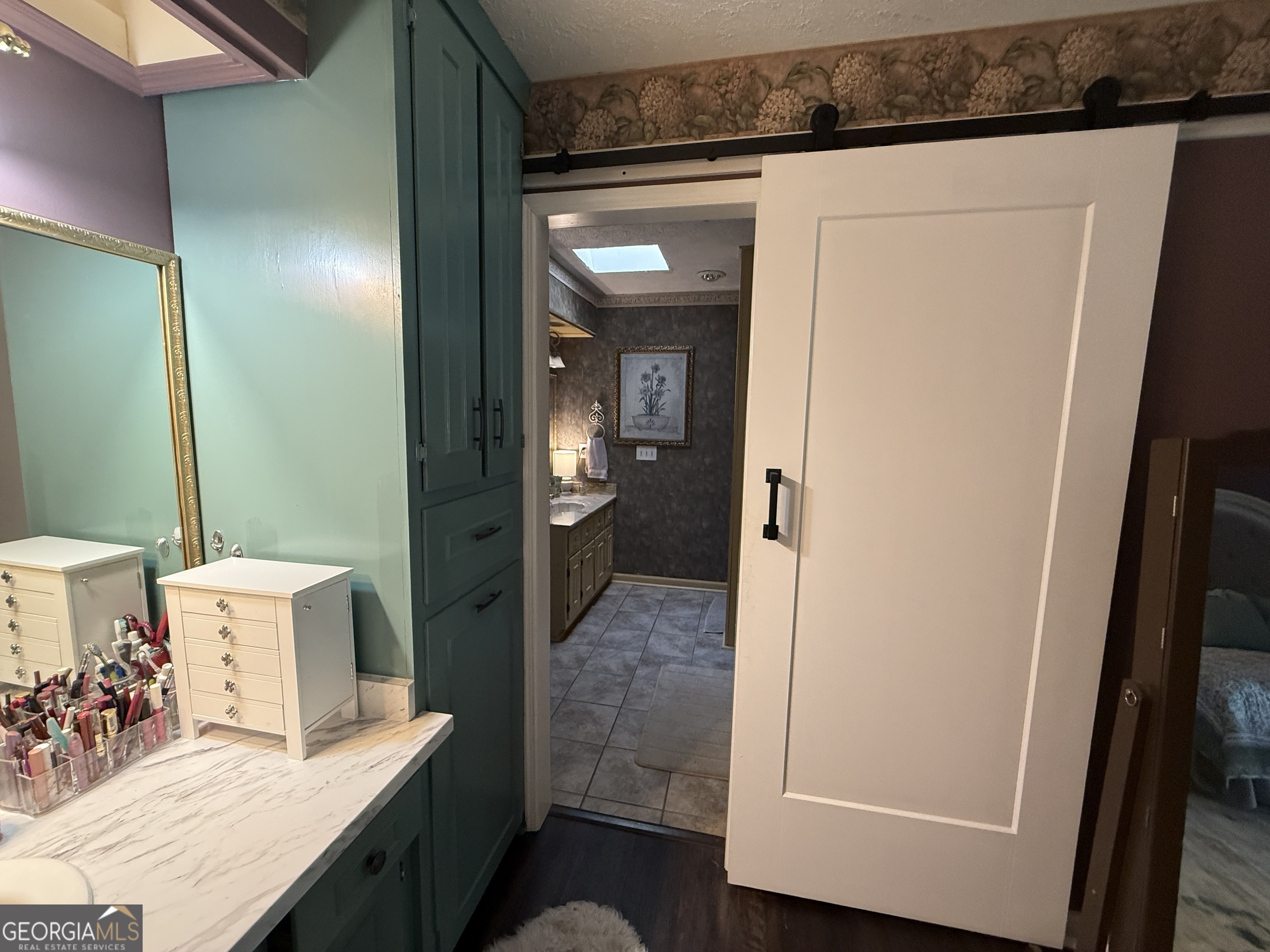 104 Monte Place Cordele, GA 31015 - Photo 22 of 52 a bathroom with a granite countertop sink and a mirror
