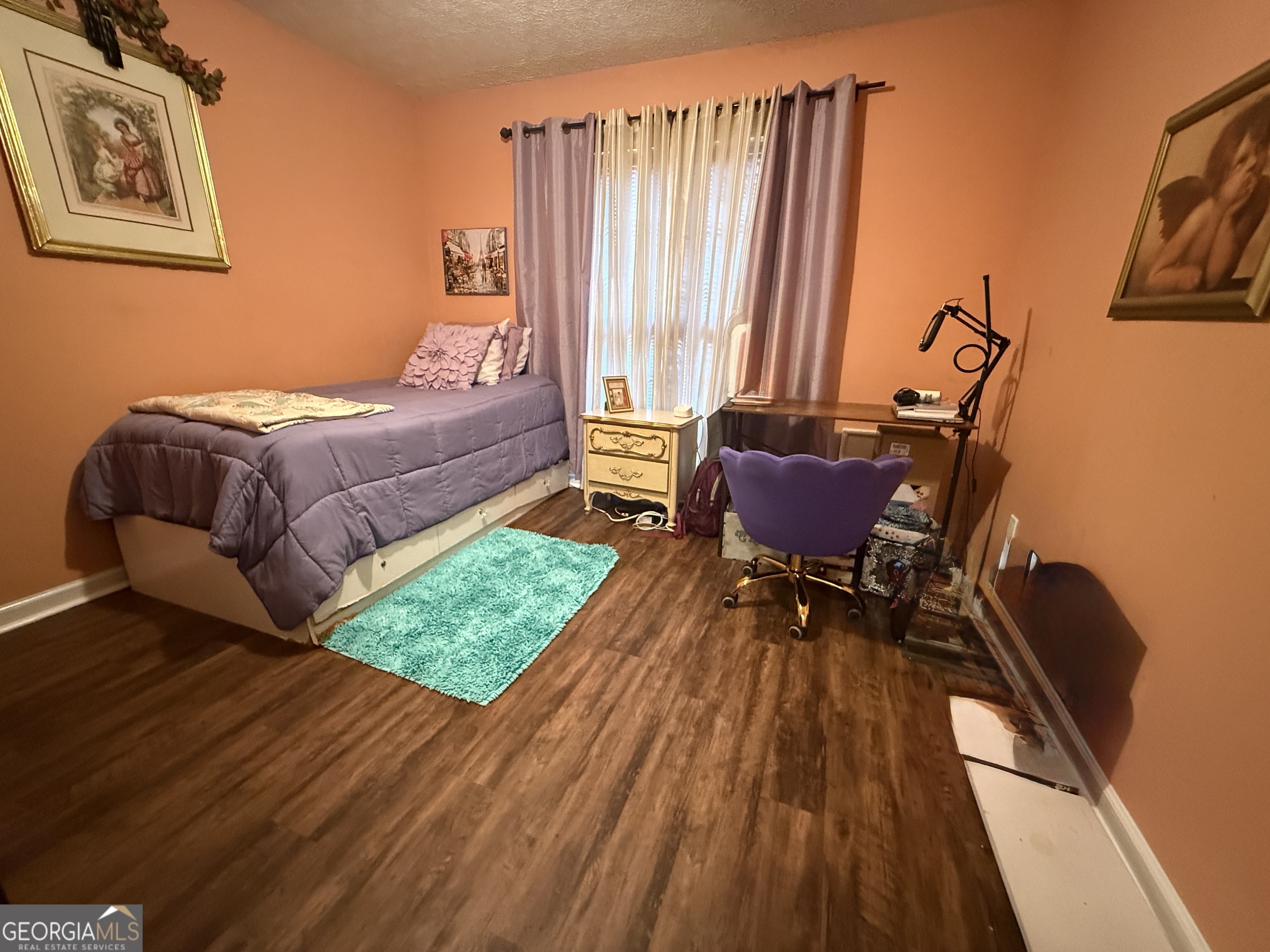 104 Monte Place Cordele, GA 31015 - Photo 28 of 52 a living room with furniture and a wooden floor