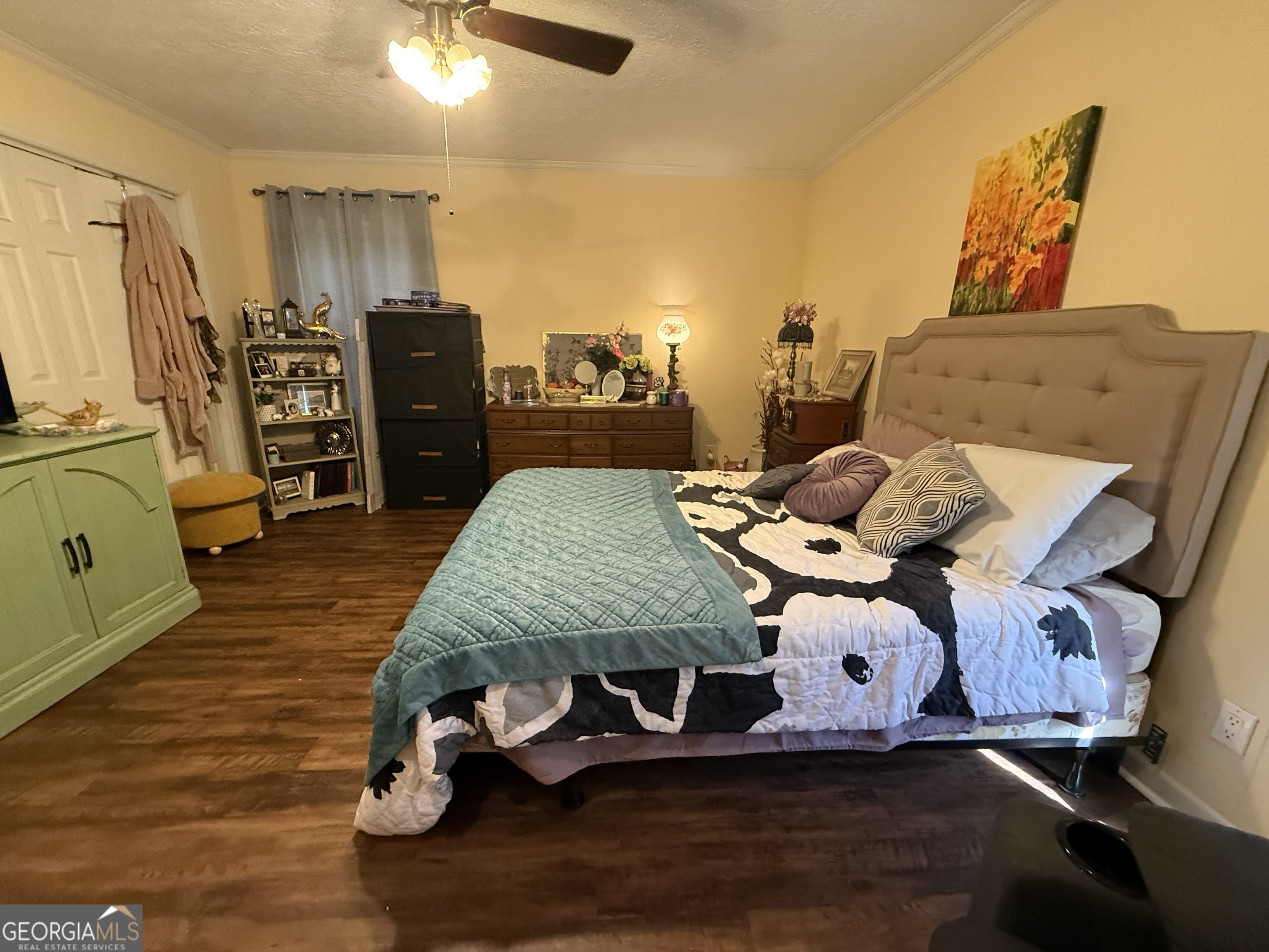 104 Monte Place Cordele, GA 31015 - Photo 30 of 52 a bedroom with a bed and wooden floor