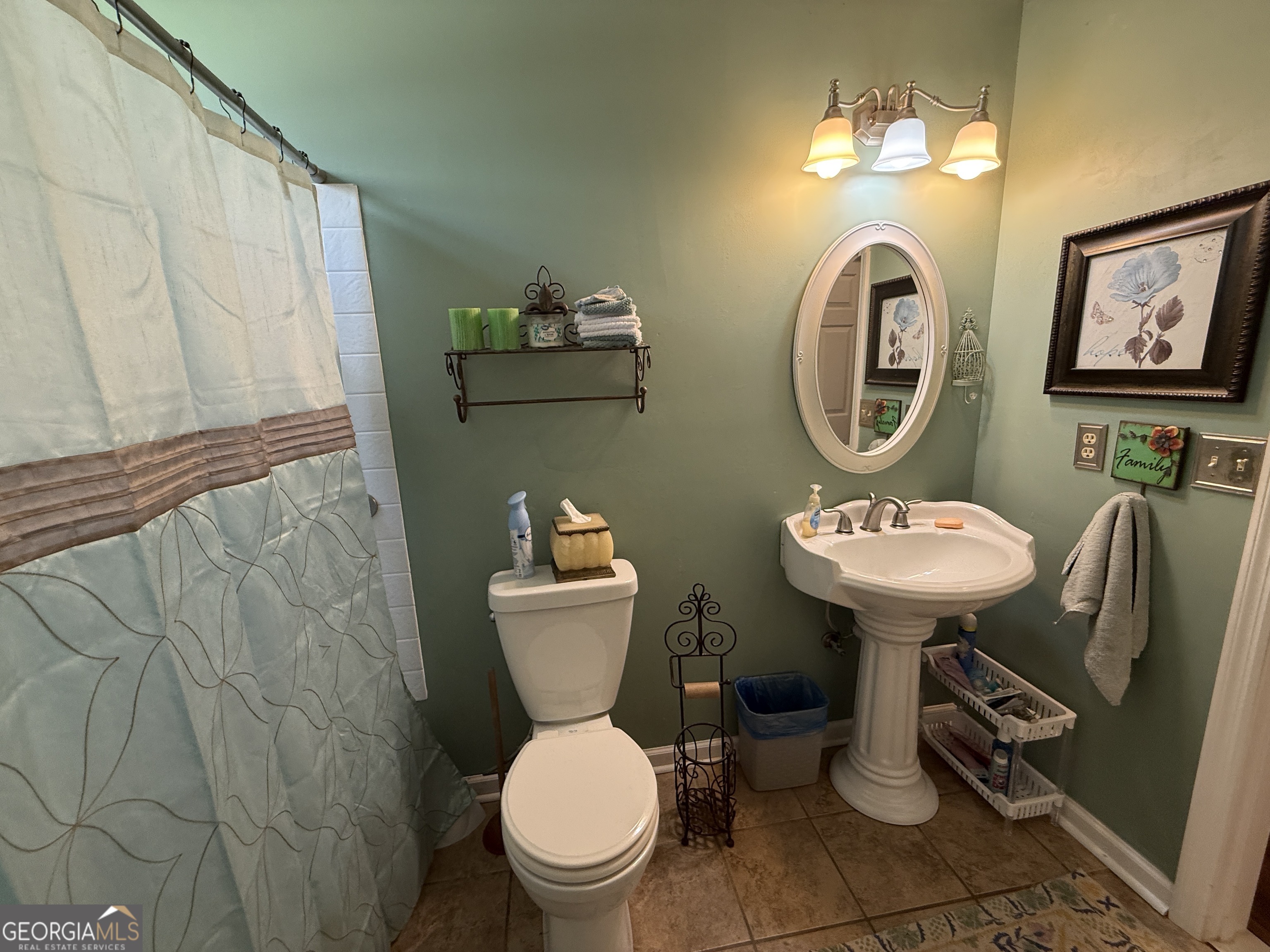 104 Monte Place Cordele, GA 31015 - Photo 33 of 52 a bathroom with a toilet sink and mirror