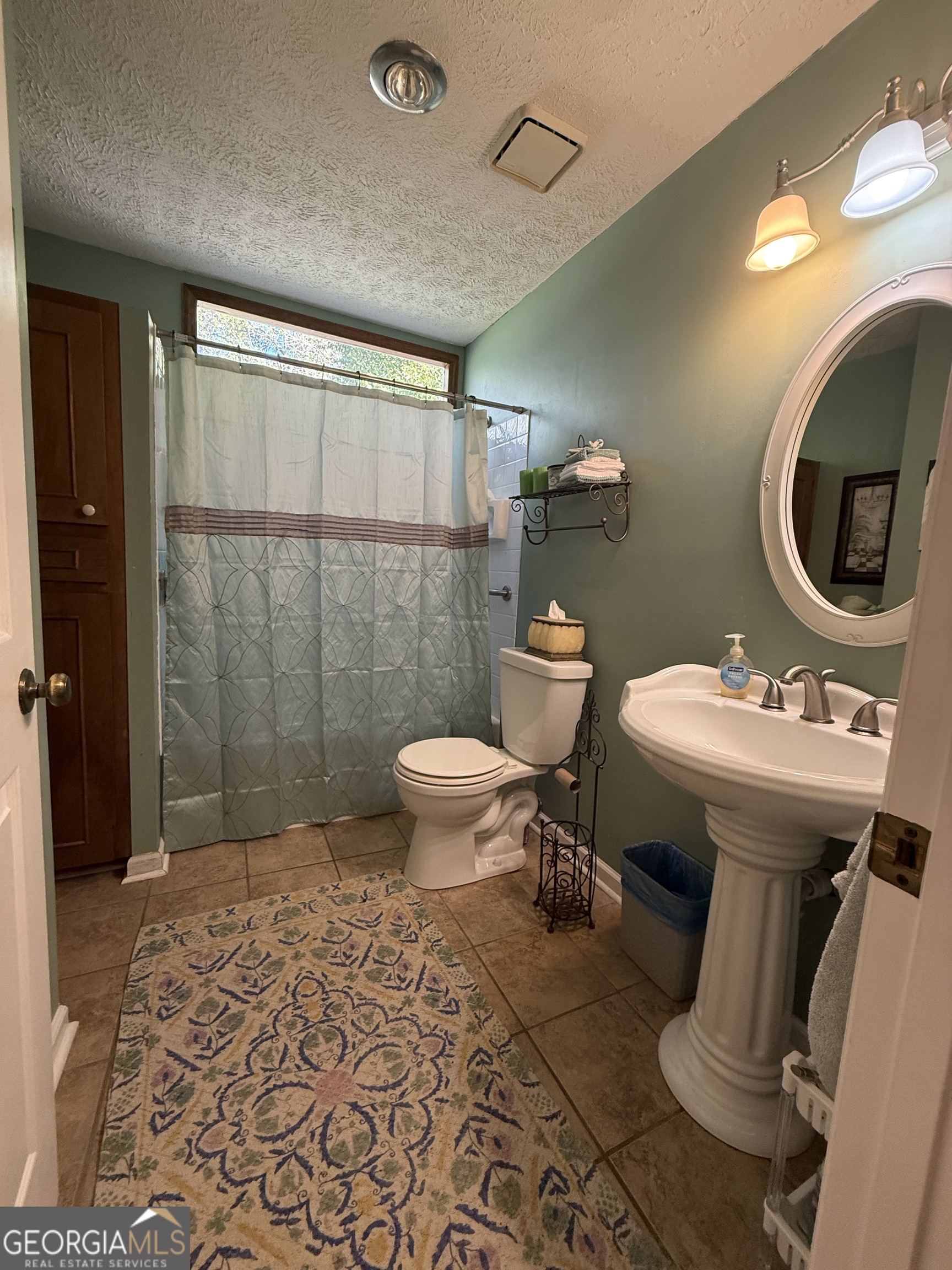 104 Monte Place Cordele, GA 31015 - Photo 34 of 52 a bathroom with a sink toilet and shower