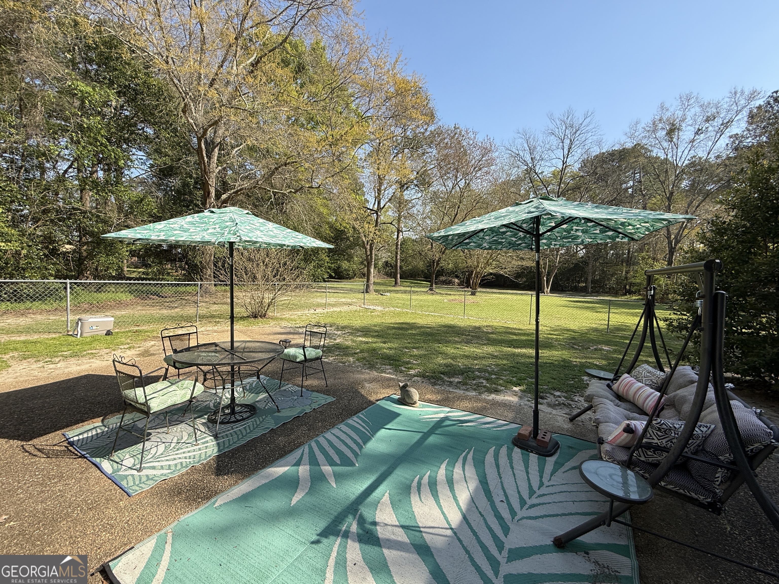 104 Monte Place Cordele, GA 31015 - Photo 47 of 52 a view of a table and chairs under an umbrella
