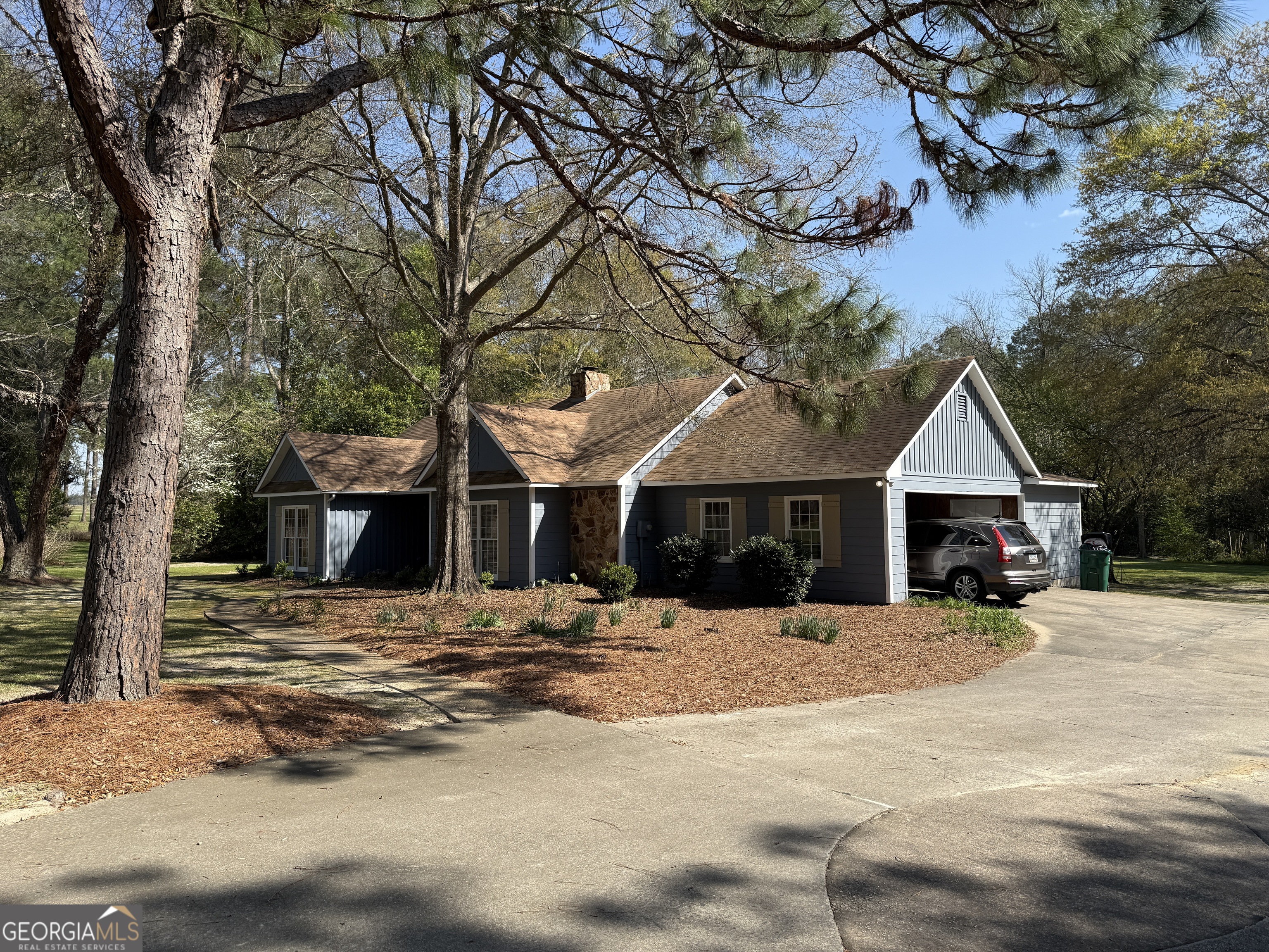 104 Monte Place Cordele, GA 31015 - Photo 51 of 52 a front view of a house with large trees