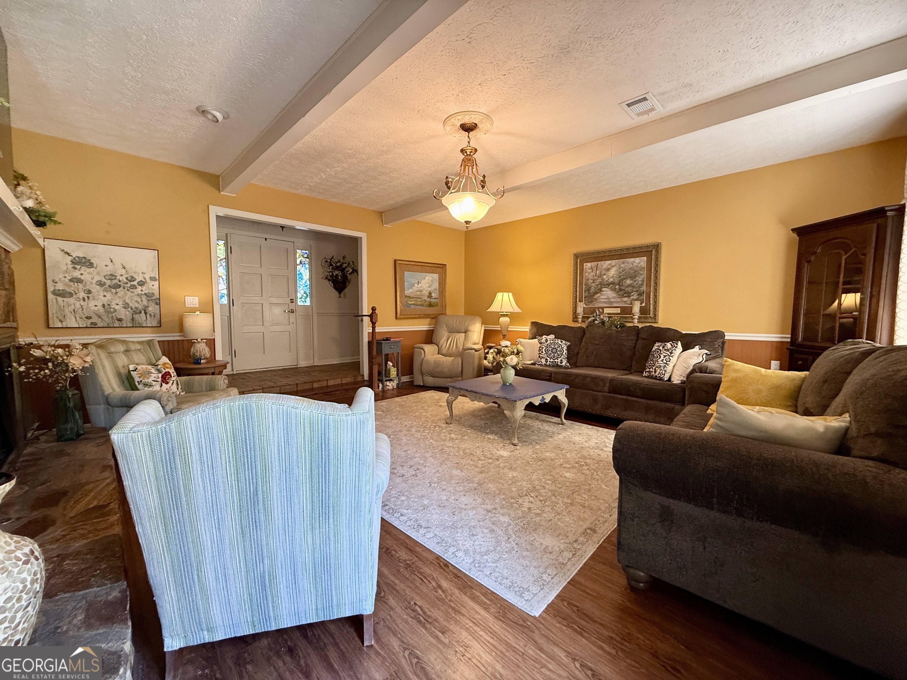 104 Monte Place Cordele, GA 31015 - Photo 9 of 52 a living room with furniture and a chandelier