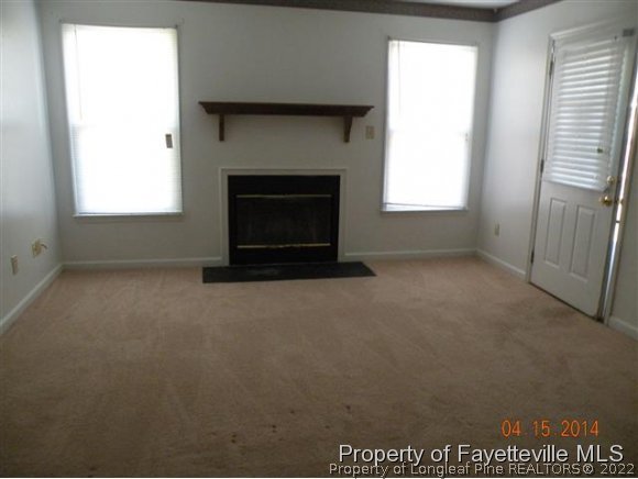 1132 Hoke Loop Road Fayetteville, NC 28314 - Photo 2 of 12 a living room with a fireplace