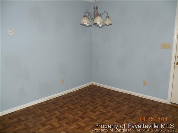 1132 Hoke Loop Road Fayetteville, NC 28314 - Photo 4 of 12 an empty room with a workspace