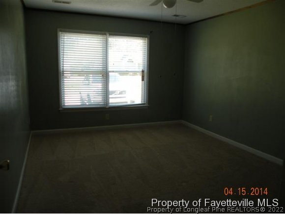 1132 Hoke Loop Road Fayetteville, NC 28314 - Photo 6 of 12 a view of an empty room with a window