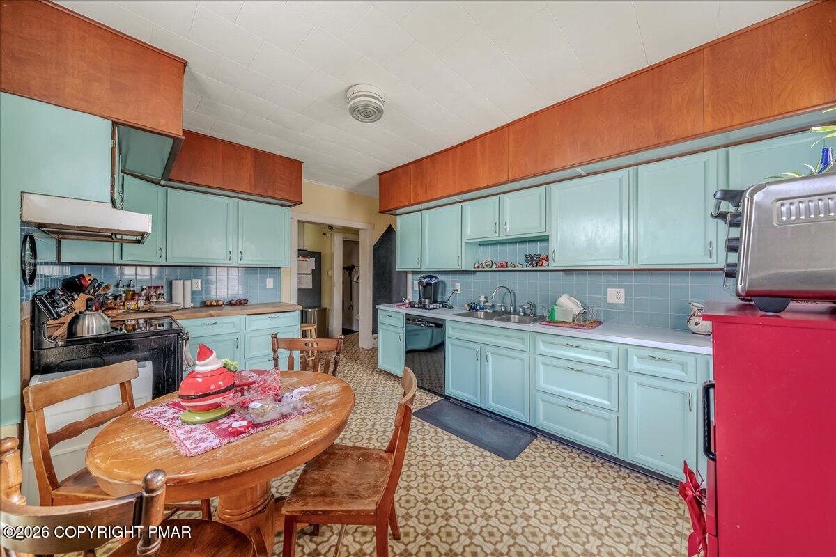 136 St George Street Lewisburg, PA 17837 - Photo 13 of 42 a kitchen with granite countertop lots of wooden furniture and stainless steel appliances