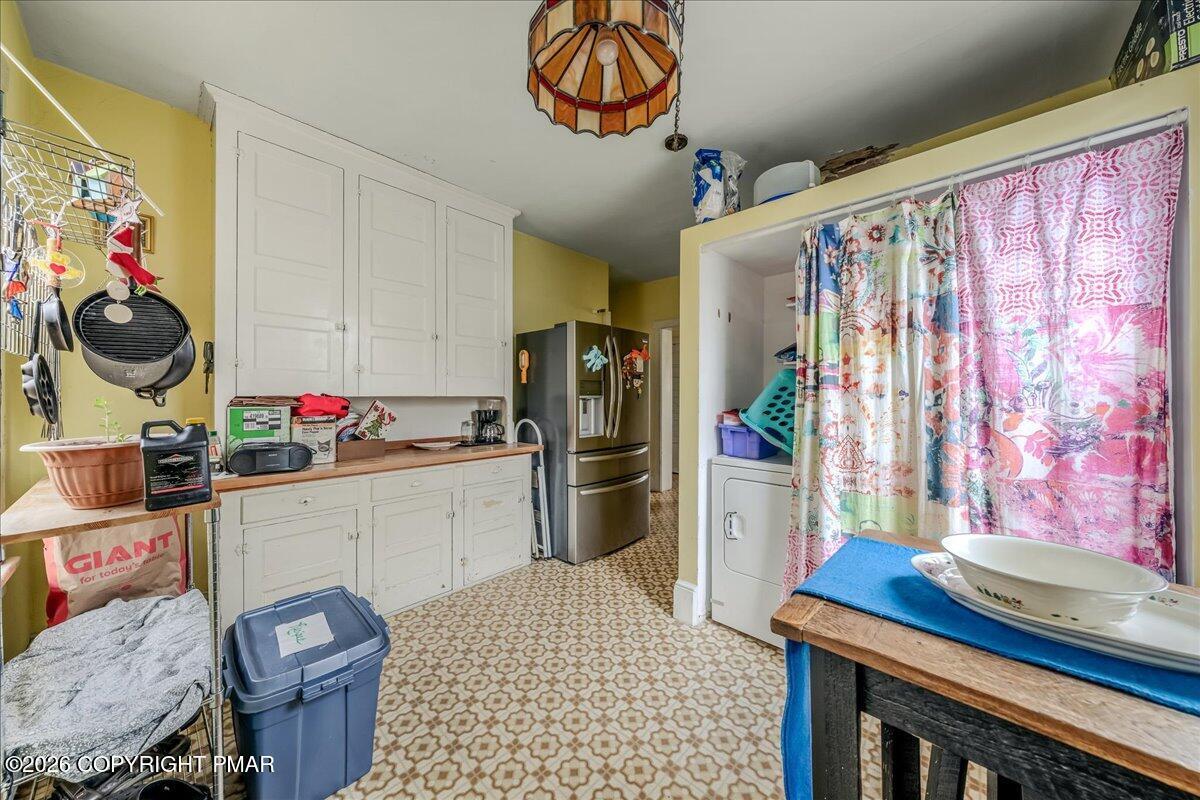 136 St George Street Lewisburg, PA 17837 - Photo 16 of 42 a kitchen with stainless steel appliances granite countertop a sink dishwasher and a refrigerator with wooden floor