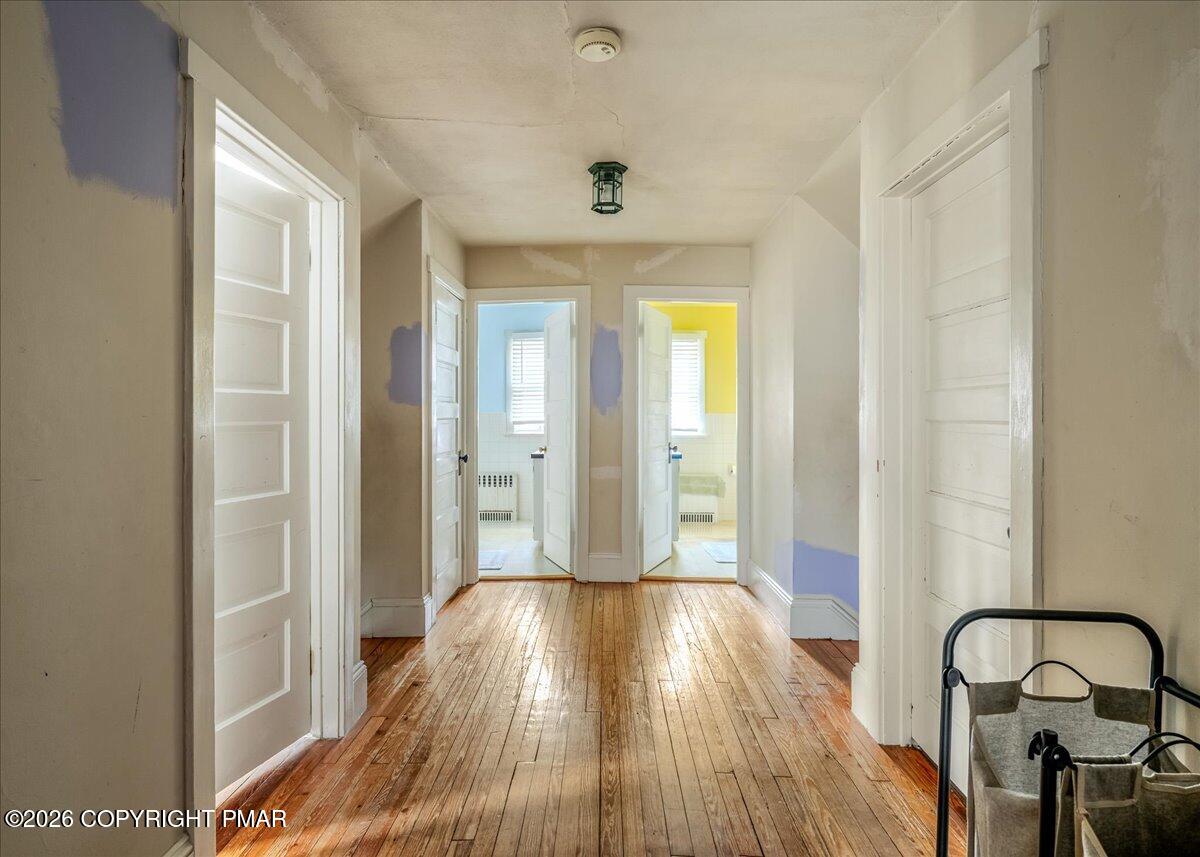 136 St George Street Lewisburg, PA 17837 - Photo 17 of 42 a view of a hallway with wooden floor and a bathroom