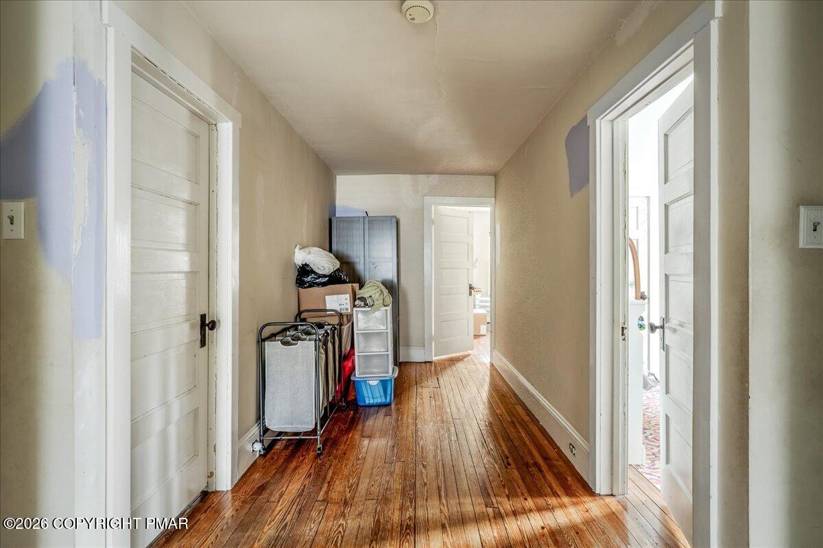 136 St George Street Lewisburg, PA 17837 - Photo 22 of 42 a view of a hallway with wooden floor and cabinets