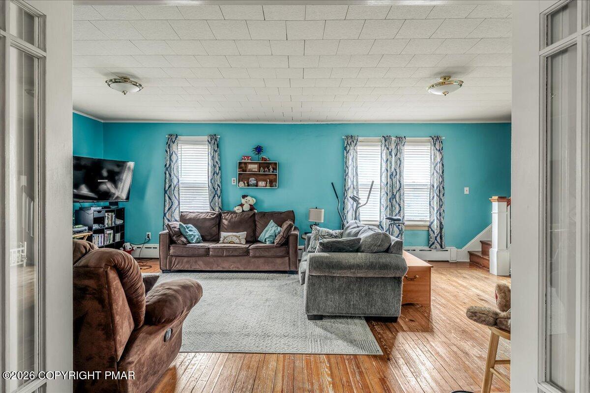 136 St George Street Lewisburg, PA 17837 - Photo 7 of 42 a living room with furniture and a wooden floor