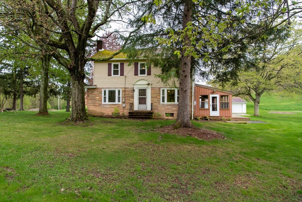 246 Forsythe Road Valencia, PA 16059 - Photo 4 of 23 a front view of a house with a garden