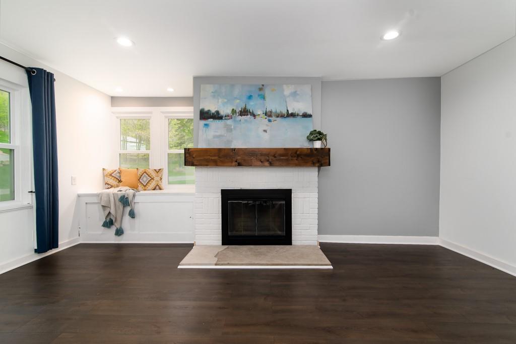 246 Forsythe Road Valencia, PA 16059 - Photo 8 of 23 a living room with furniture and a fireplace