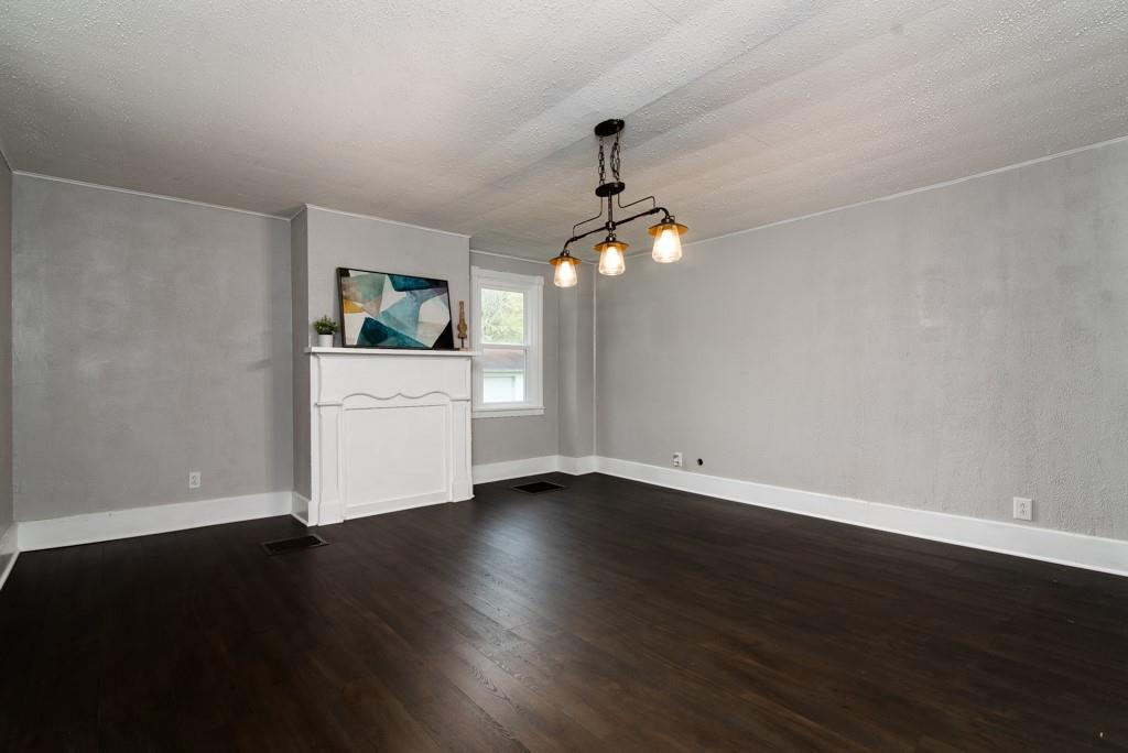 246 Forsythe Road Valencia, PA 16059 - Photo 10 of 23 an empty room with wooden floor mirror and windows