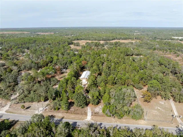 a view of a yard with a tree