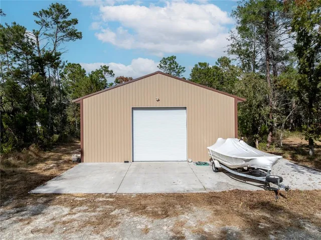 a side view of a house with a yard