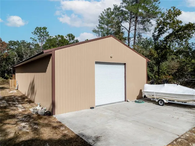 a group of people sitting in a room with gym equipment