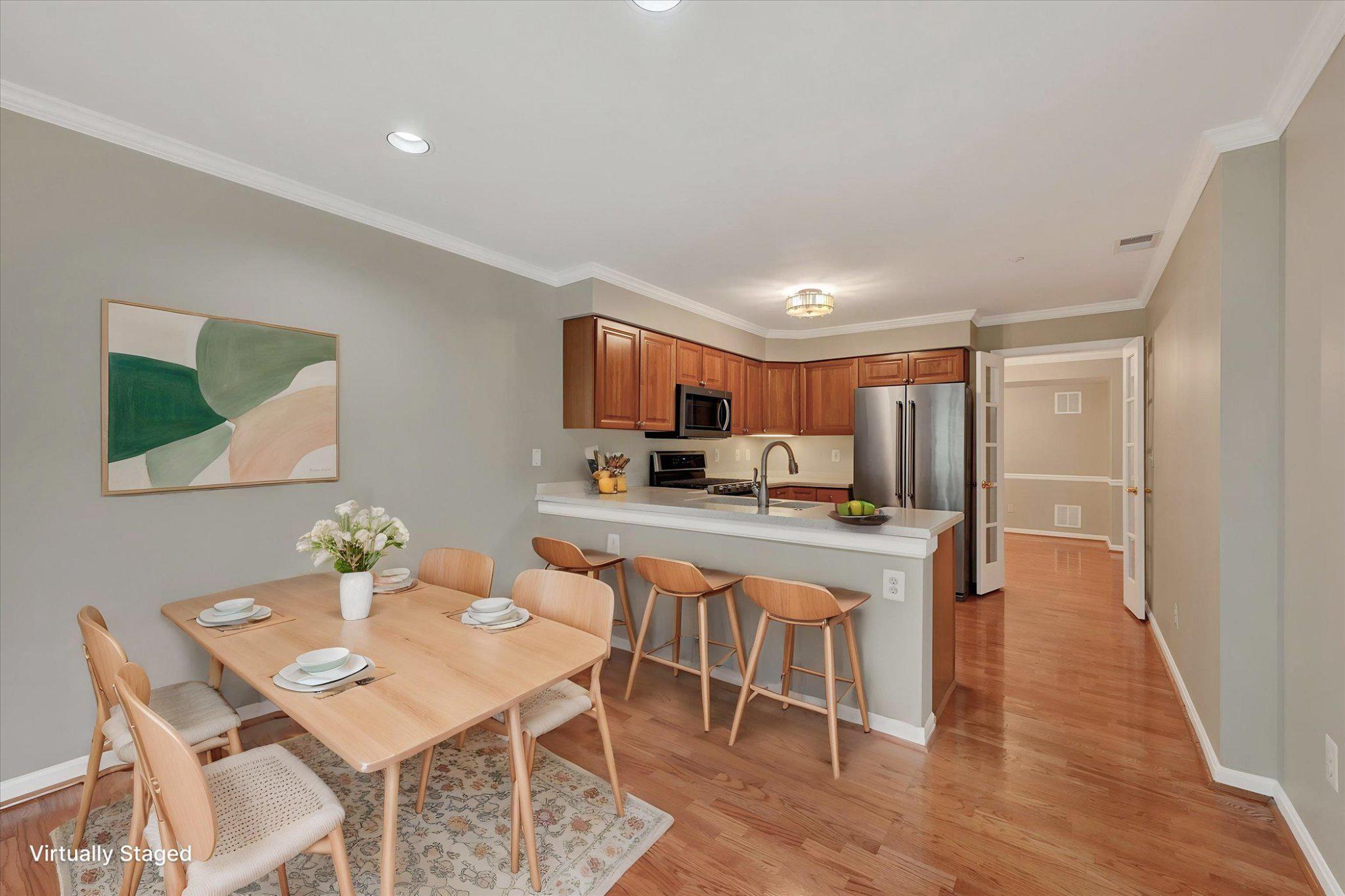 12310 Rosslare Ridge Road, Unit 405 Lutherville-Timonium, MD 21093 - Photo 17 of 30 Virtually staged kitchen with inviting dining area