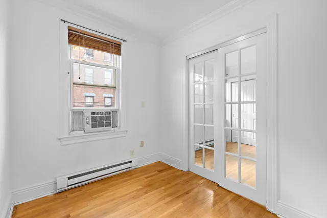 a view of an empty room with a window