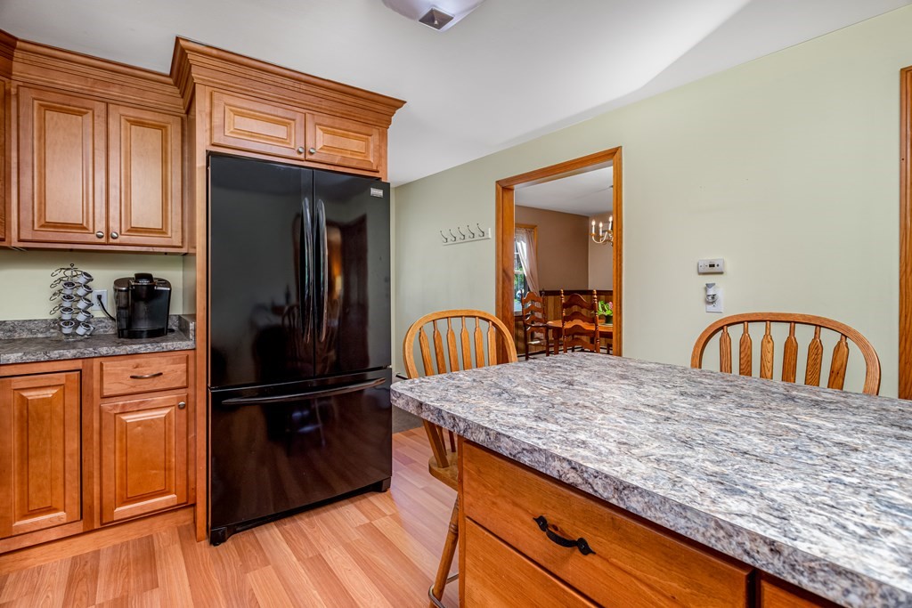 2 Victor Drive Ayer, MA 01432 - Photo 11 of 42 a kitchen with granite countertop a refrigerator and a stove top oven