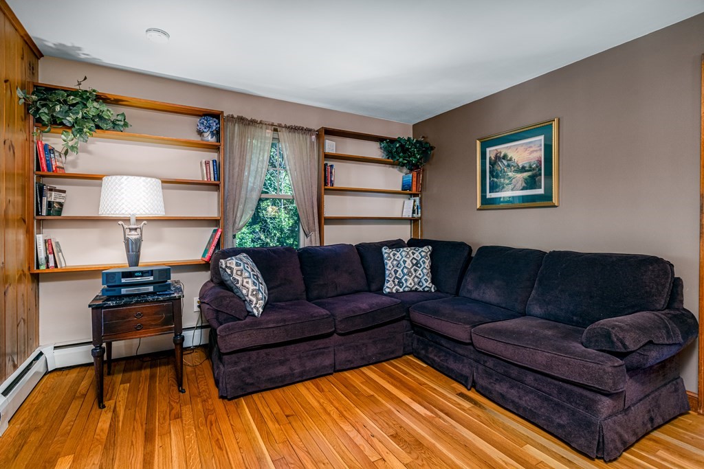 2 Victor Drive Ayer, MA 01432 - Photo 14 of 42 a living room with furniture and a wooden floor