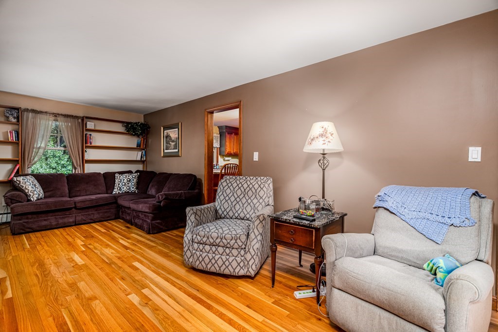 2 Victor Drive Ayer, MA 01432 - Photo 17 of 42 a living room with furniture and a lamp