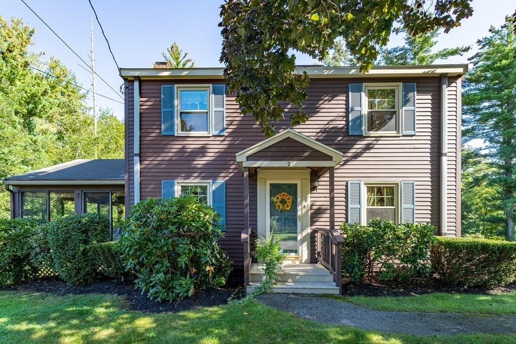2 Victor Drive Ayer, MA 01432 - Photo 2 of 42 a front view of a house with a yard and potted plants