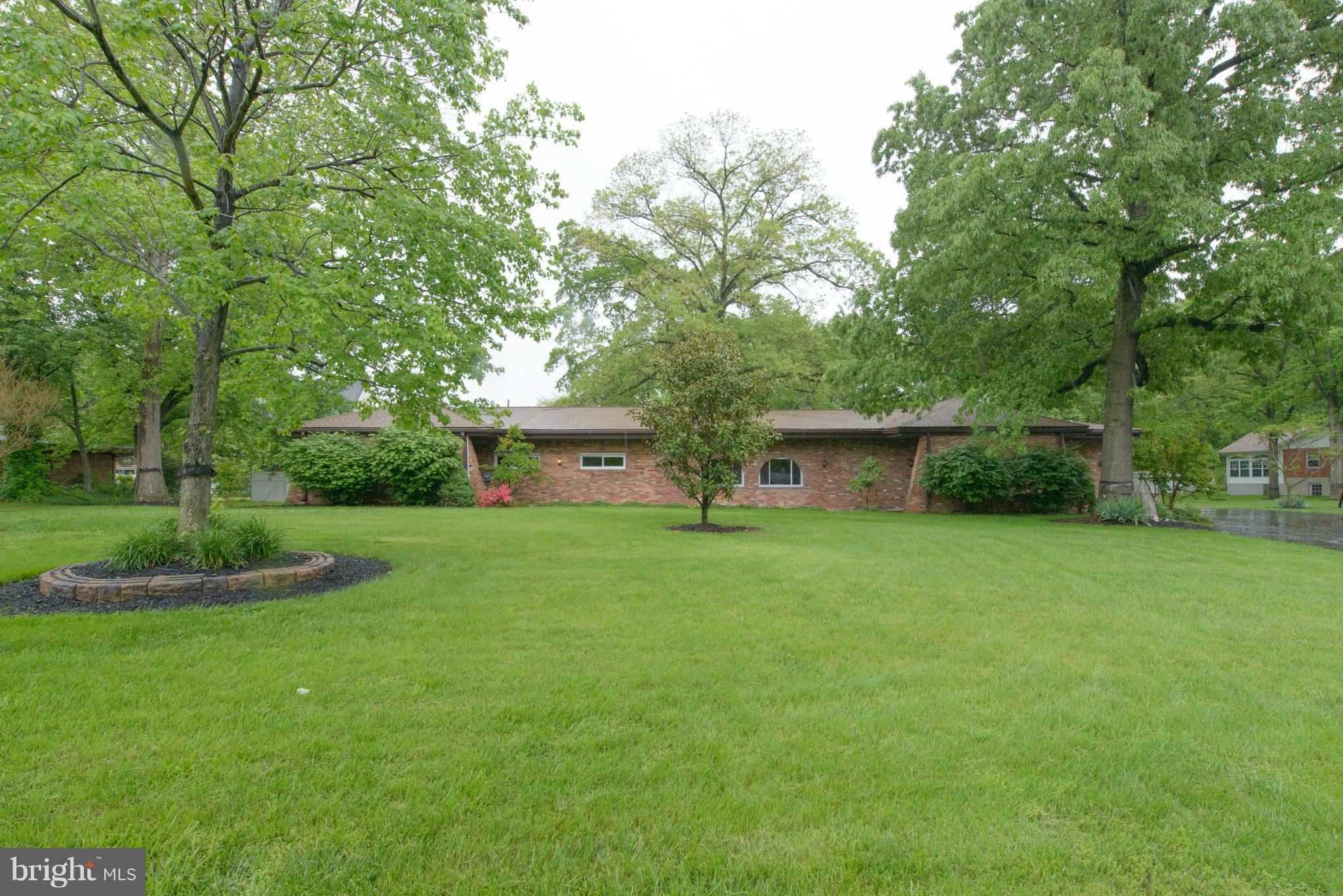 8213 WB&A Road Severn, MD 21144 - Photo 1 of 30 a front view of a house with garden