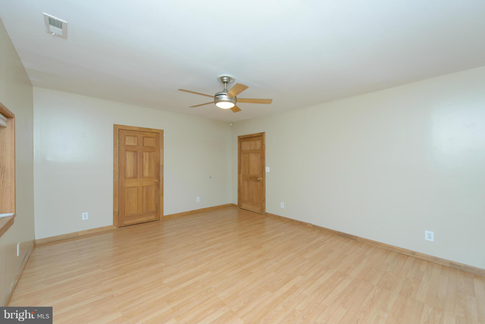 8213 WB&A Road Severn, MD 21144 - Photo 17 of 30 a view of an empty room and chandelier fan