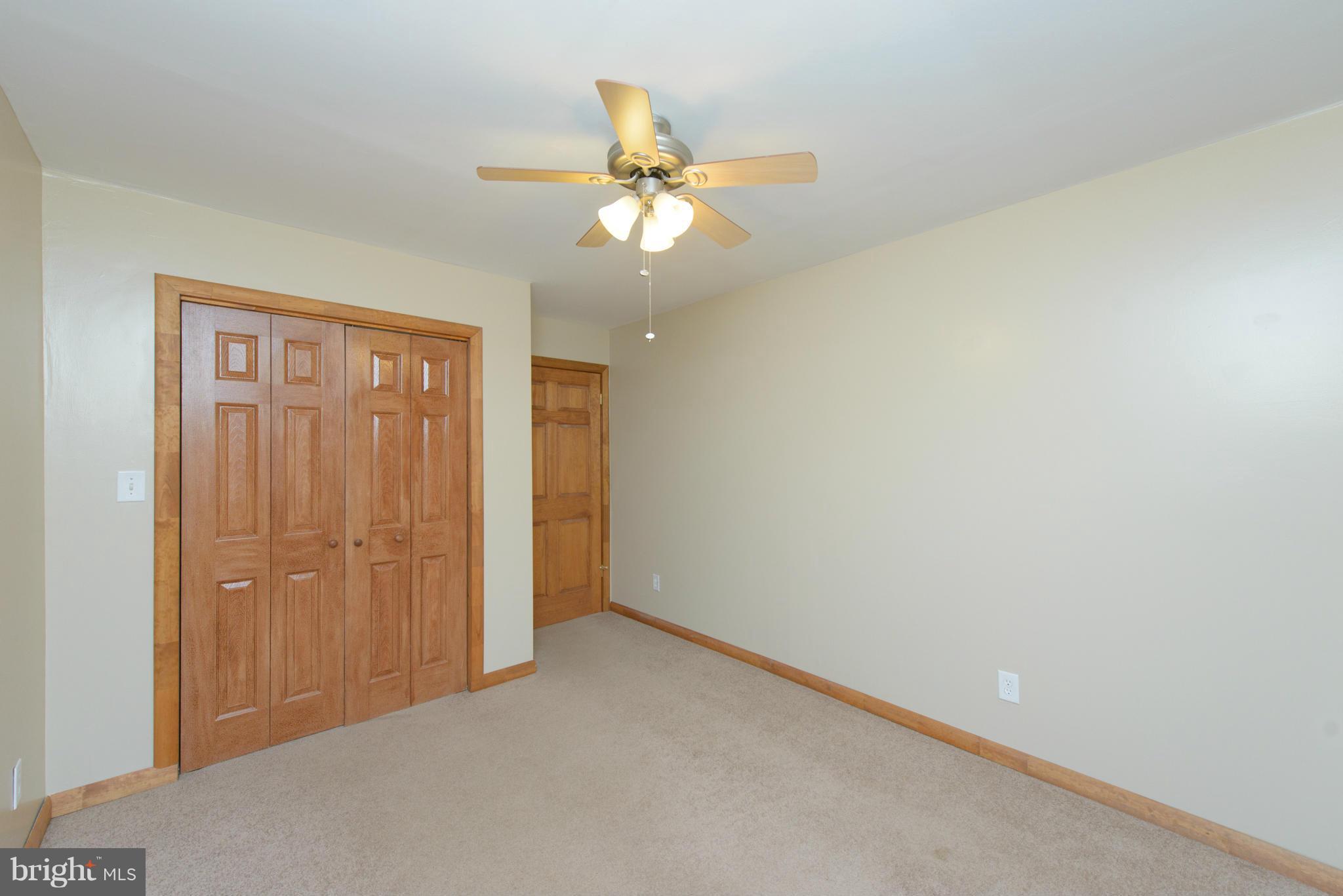 8213 WB&A Road Severn, MD 21144 - Photo 19 of 30 a view of an empty room and chandelier fan