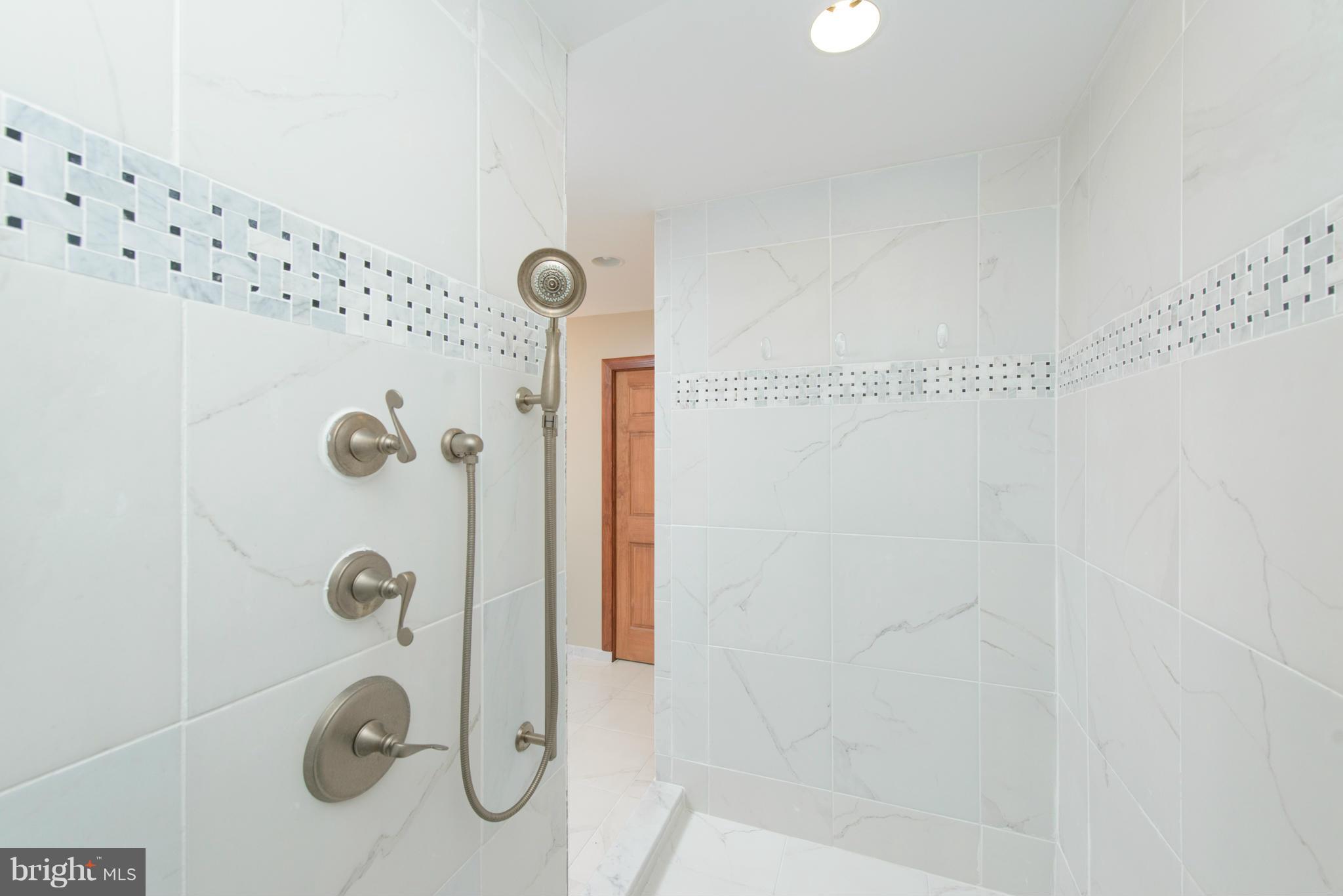 8213 WB&A Road Severn, MD 21144 - Photo 24 of 30 a bathroom with a shower