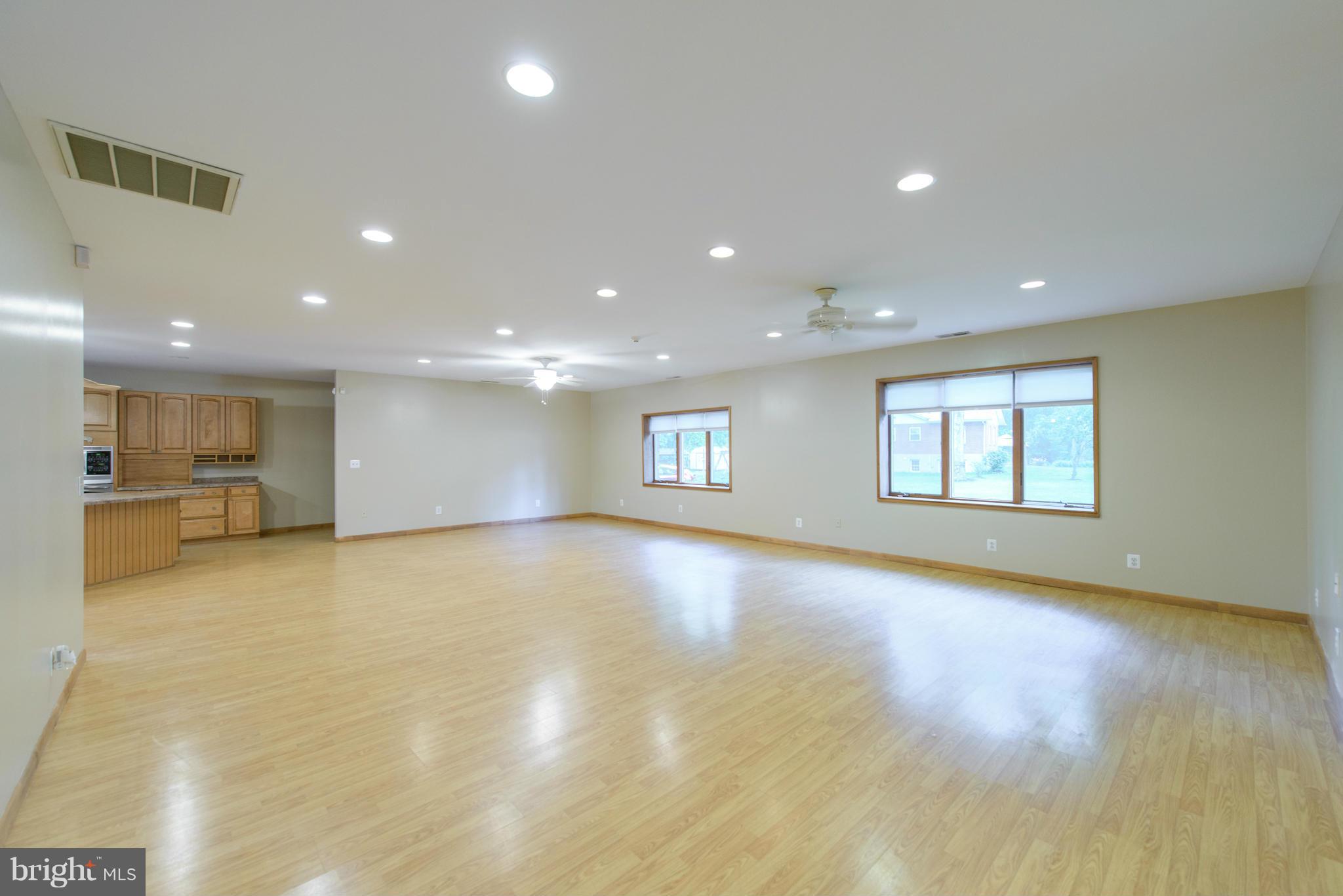 8213 WB&A Road Severn, MD 21144 - Photo 9 of 30 a view of an empty room with window and wooden floor