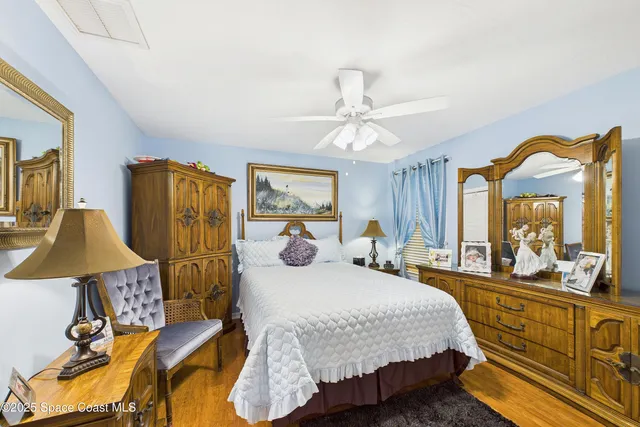 an aerial view of residential houses with outdoor space and lake view