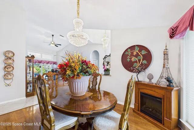 a living room with fireplace furniture and a flat screen tv
