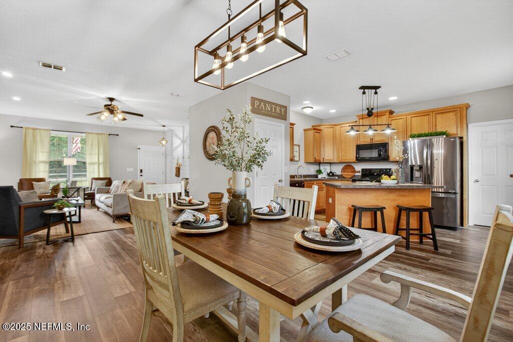 204 Comer Road Palatka, FL 32177 - Photo 13 of 61 a living room with lots of furniture and view of kitchen