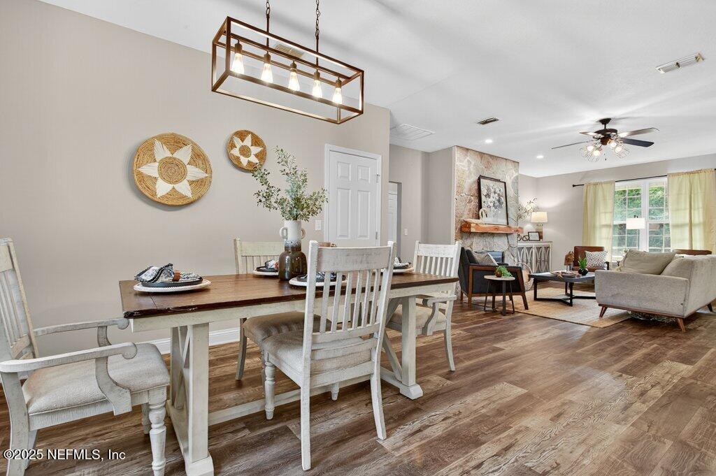 204 Comer Road Palatka, FL 32177 - Photo 14 of 61 a view of a dining room with furniture and wooden floor