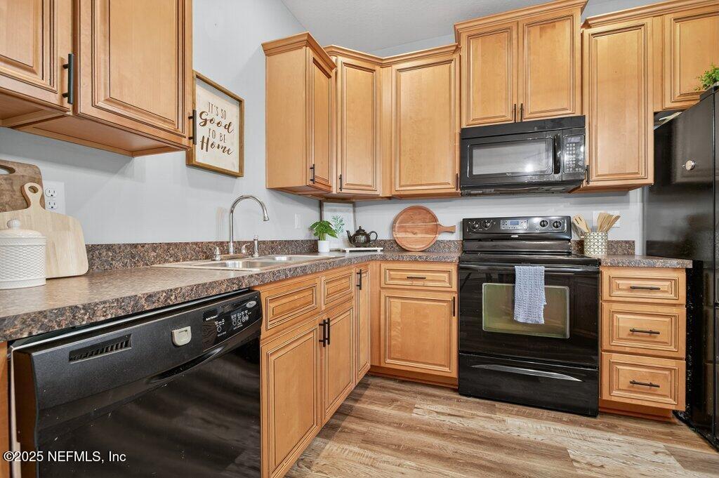 204 Comer Road Palatka, FL 32177 - Photo 16 of 61 a kitchen with stainless steel appliances granite countertop a stove and a microwave