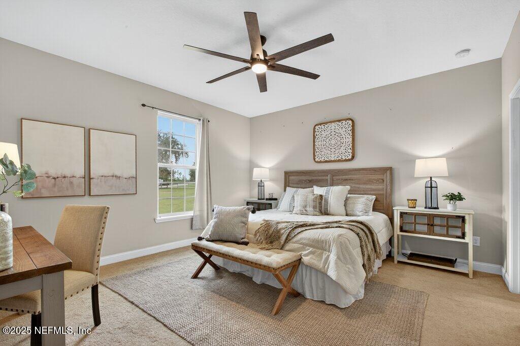 204 Comer Road Palatka, FL 32177 - Photo 22 of 61 a bedroom with a bed a couch and a window