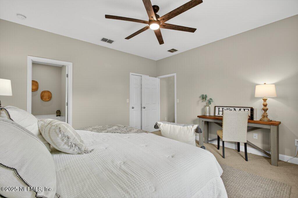 204 Comer Road Palatka, FL 32177 - Photo 24 of 61 a bedroom with a bed and a table