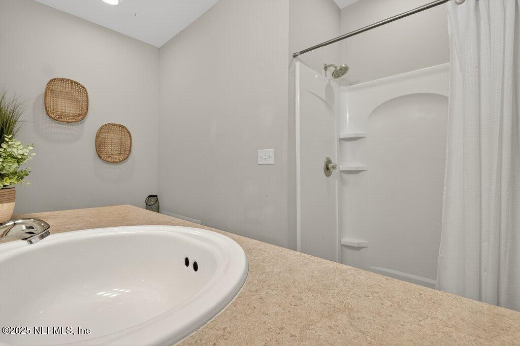 204 Comer Road Palatka, FL 32177 - Photo 27 of 61 a bathroom with a sink and a mirror