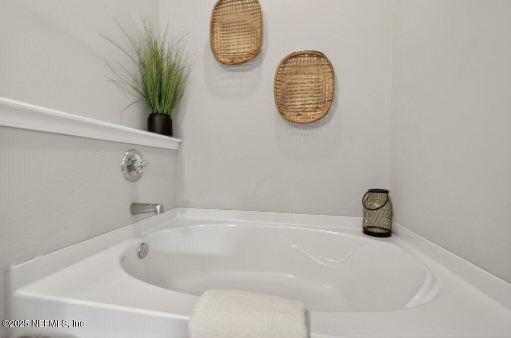 204 Comer Road Palatka, FL 32177 - Photo 29 of 61 a bathroom with a tub and a window