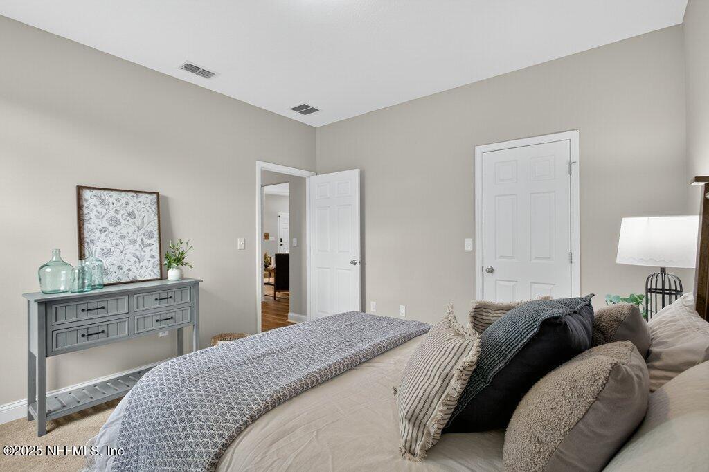 204 Comer Road Palatka, FL 32177 - Photo 31 of 61 a bedroom with a bed and a dresser