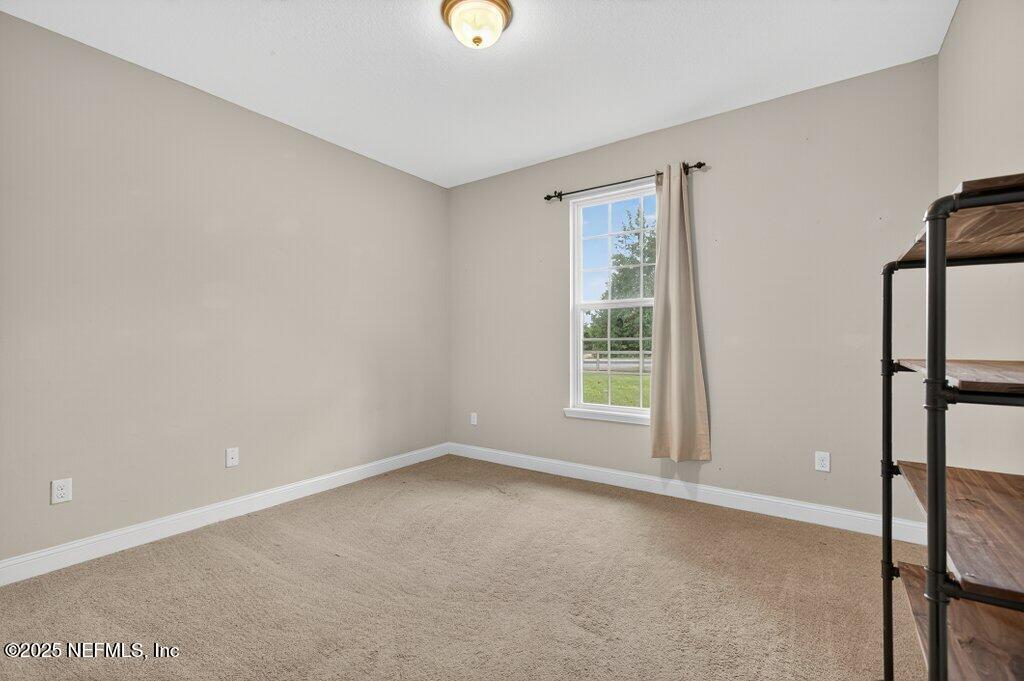204 Comer Road Palatka, FL 32177 - Photo 34 of 61 a view of an empty room with a window