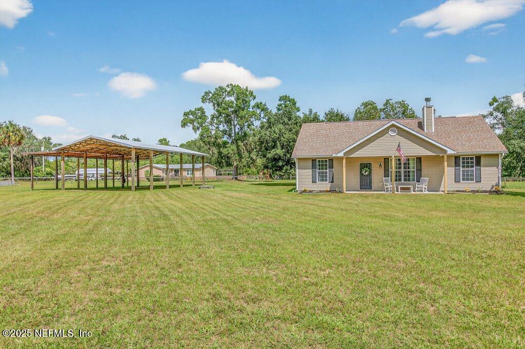 204 Comer Road Palatka, FL 32177 - Photo 4 of 61 a view of a house with a yard and potted plants
