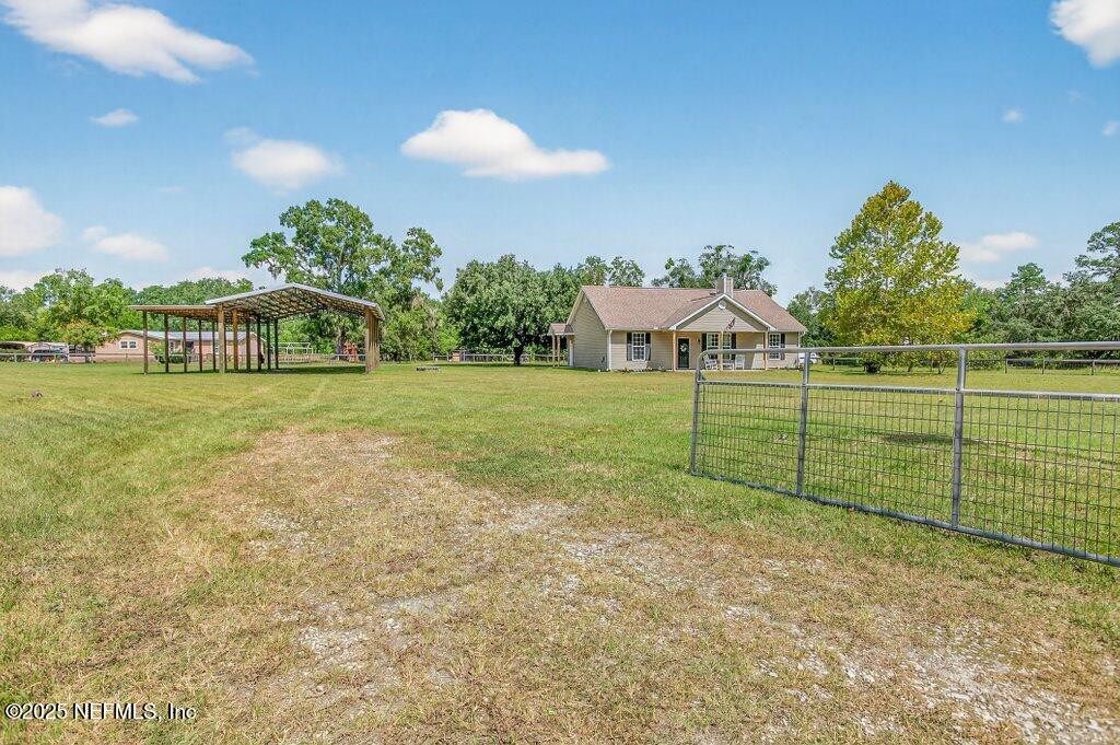 204 Comer Road Palatka, FL 32177 - Photo 49 of 61 a view of a field of grass and trees
