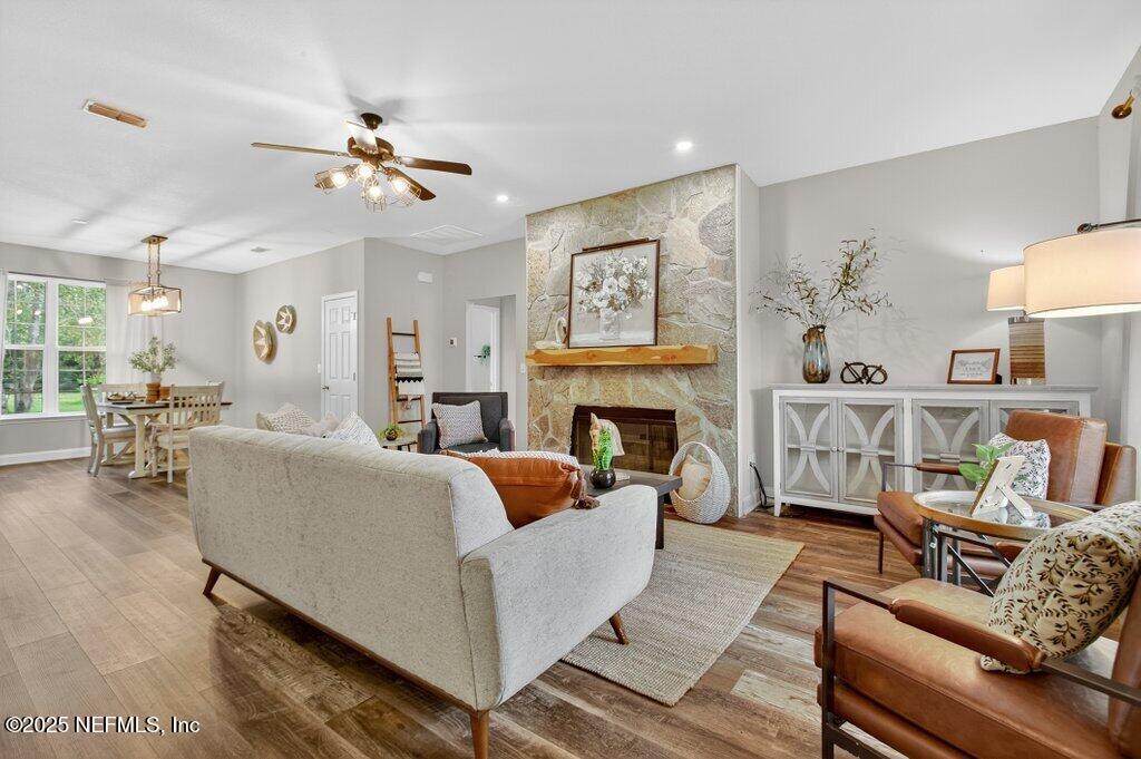 204 Comer Road Palatka, FL 32177 - Photo 7 of 61 a living room with furniture a fireplace and a table