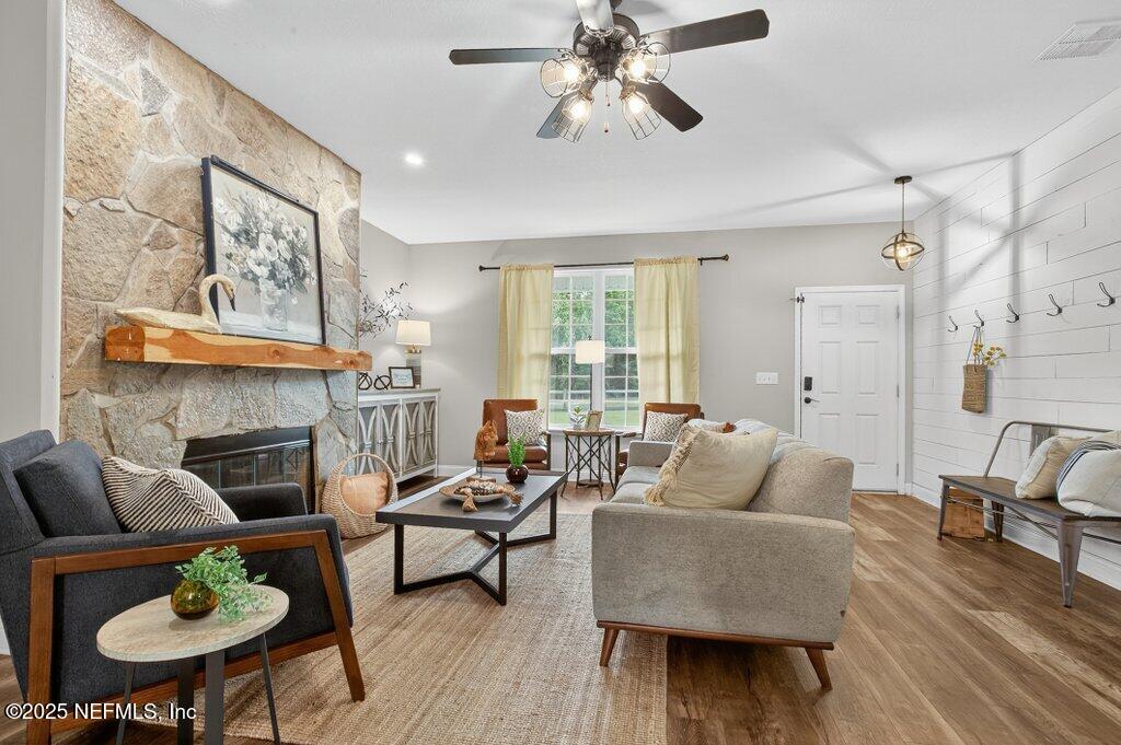 204 Comer Road Palatka, FL 32177 - Photo 8 of 61 a living room with furniture and a fireplace