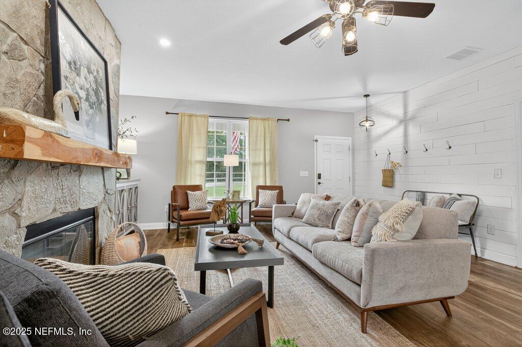 204 Comer Road Palatka, FL 32177 - Photo 9 of 61 a living room with furniture and a fireplace